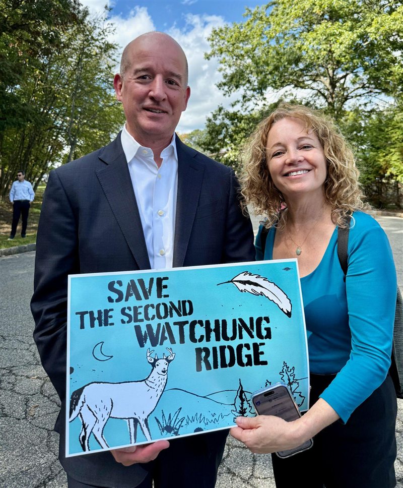 Joyce Rudin with a supporter holding a “Save the Second Watchung Ridge” sign